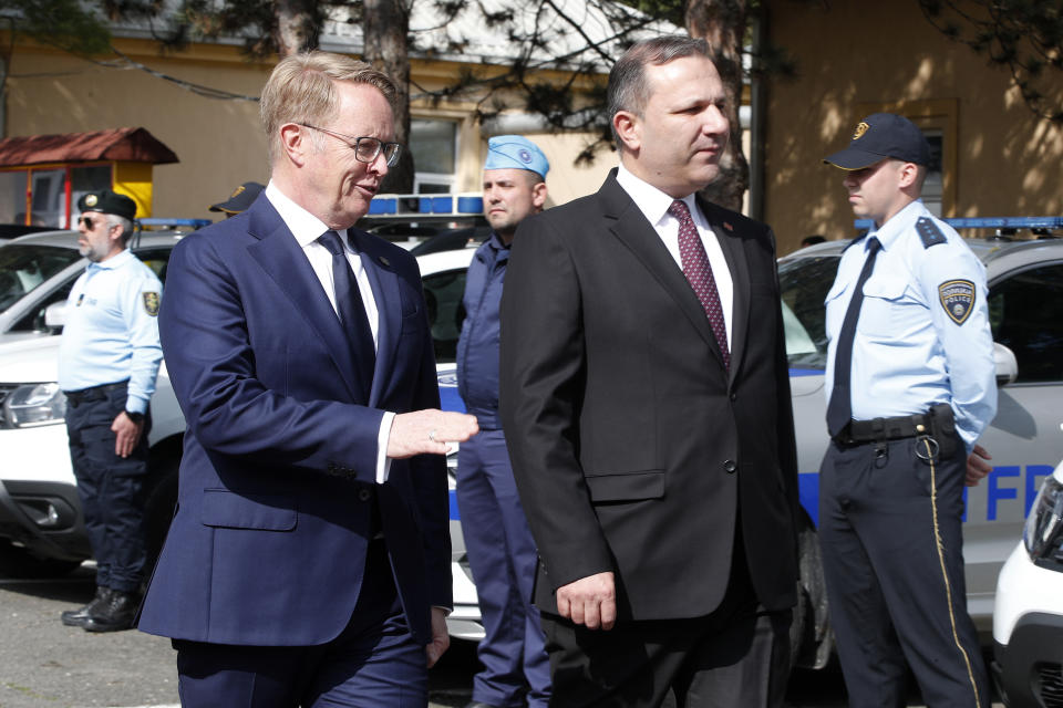 Frontex's Executive Director Hans Leijtens, left, and North Macedonia's Interior Minister Oliver Spasovski, review the Standing Corps and Macedonian Border Police officers, during the official launch of the Frontex Joint Operation in North Macedonia, at police barracks in Skopje, North Macedonia, on Thursday, April 20. 2023. (AP Photo/Boris Grdanoski)