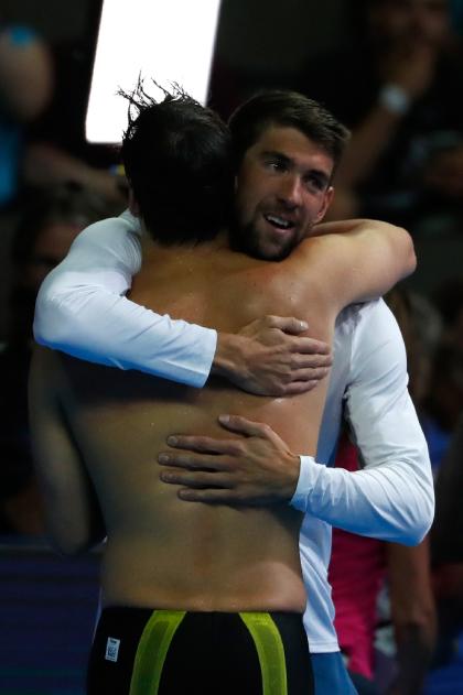 Michael Phelps (R) congratulates Chase Kalisz after Kalisz won the men&#39;s 400 IM Sunday. (AFP)