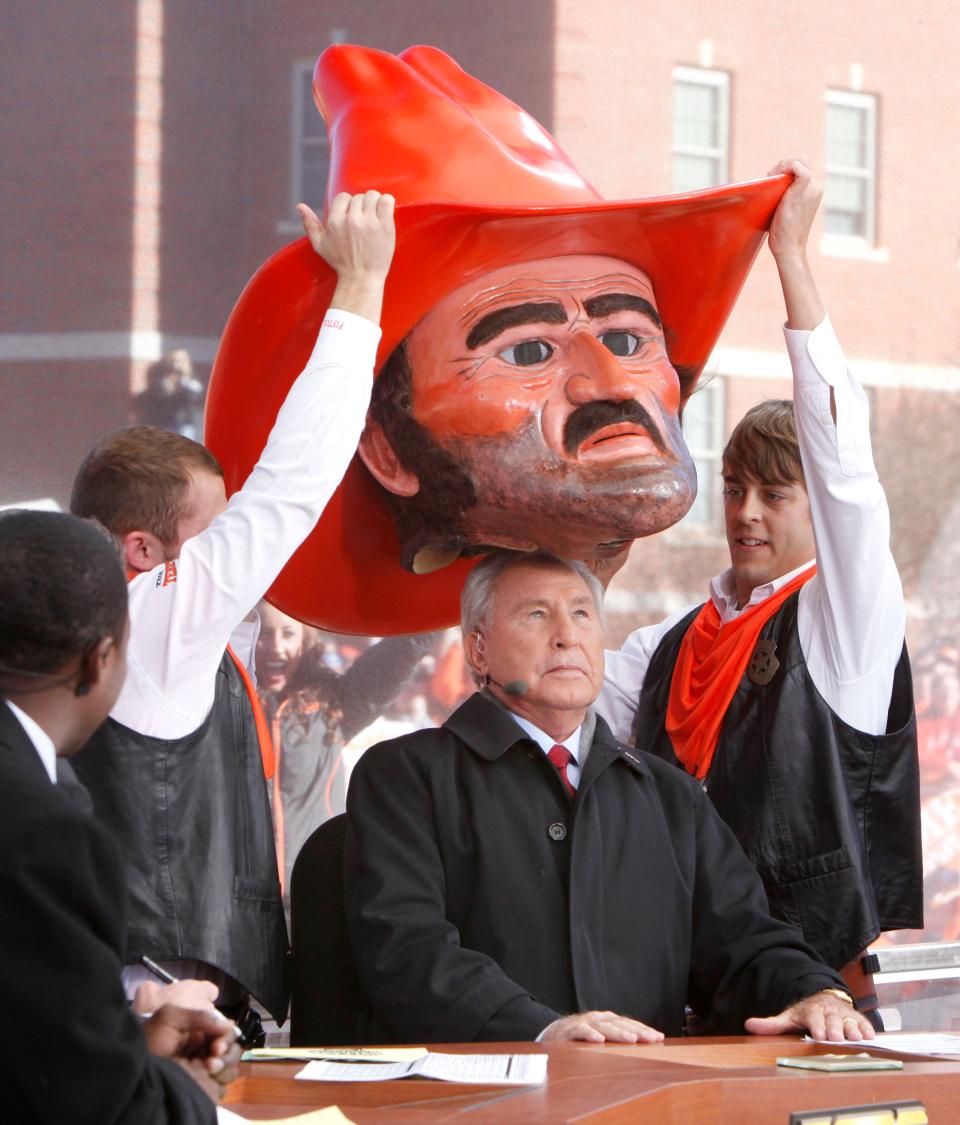 ESPN College Gameday host Lee Corso dons the head of OSU mascot Pistol Pete in Stillwater on Nov. 27, 2010.