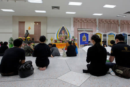 People pray for Thailand's late King Bhumibol Adulyadej in Bangkok, Thailand, October 14, 2016. REUTERS/Chaiwat Subprasom