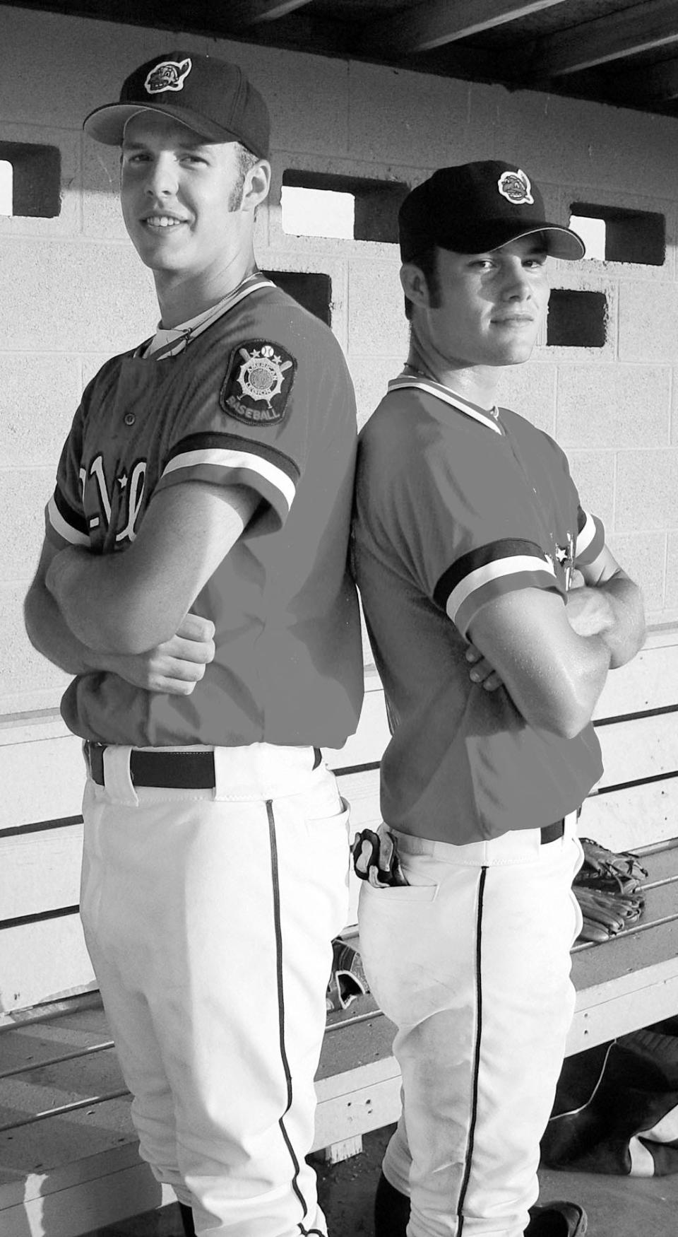 BLASTS FROM THE PAST: Bryan Kayser, left, and Lincoln Kent of the Bartlesville Doenges Ford Indians pose during an American Legion game in the early 2000's after they had blasted back-to-back homers. (Mike Tupa/Examiner-Enterprise)