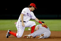 ARLINGTON, TX - OCTOBER 24: Matt Holliday #7 of the St. Louis Cardinals slides into second base safely ahead of the tag by Ian Kinsler #5 of the Texas Rangers after a wild pitch in the second inning during Game Five of the MLB World Series at Rangers Ballpark in Arlington on October 24, 2011 in Arlington, Texas. (Photo by Rob Carr/Getty Images)