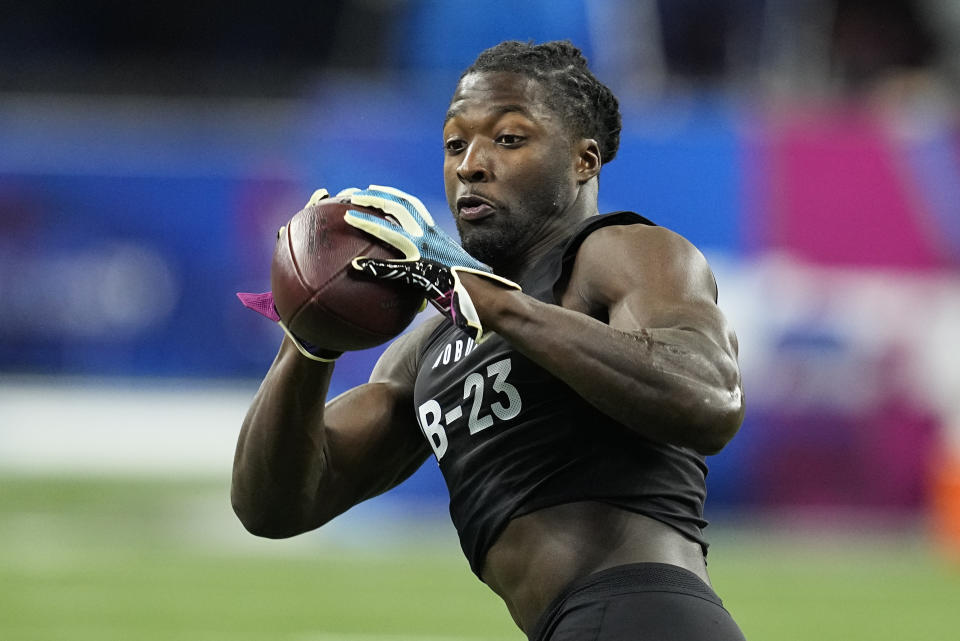 FILE - Tulane running back Tyjae Spears runs a drill at the NFL football scouting combine in Indianapolis, Sunday, March 5, 2023. The NFL Draft begins Thursday, April 27 in Kansas City, Mo. (AP Photo/Darron Cummings, File)