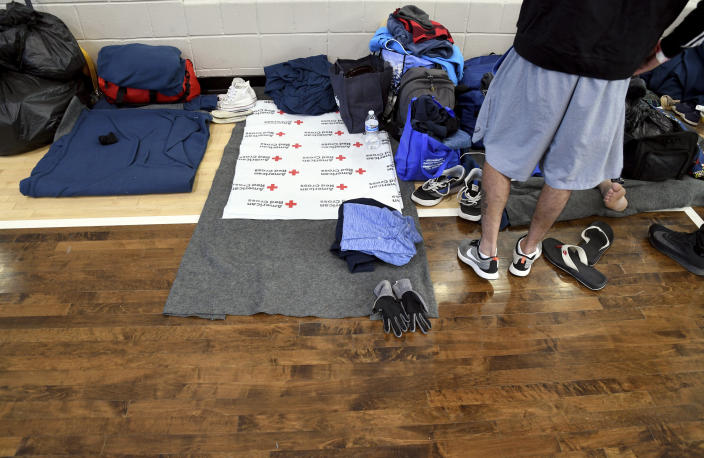 Blankets and belongings are arranged at a makeshift shelter in Denver on Friday, Jan. 6, 2023. Over the past month, nearly 4,000 immigrants, almost all Venezuelans, have arrived unannounced in the frigid city, with nowhere to stay and sometimes wearing T-shirts and flip-flops. In response, Denver converted three recreation centers into emergency shelters for migrants and paid for families with children to stay at hotels, allocating $3 million to deal with the influx. (AP Photo/Thomas Peipert)