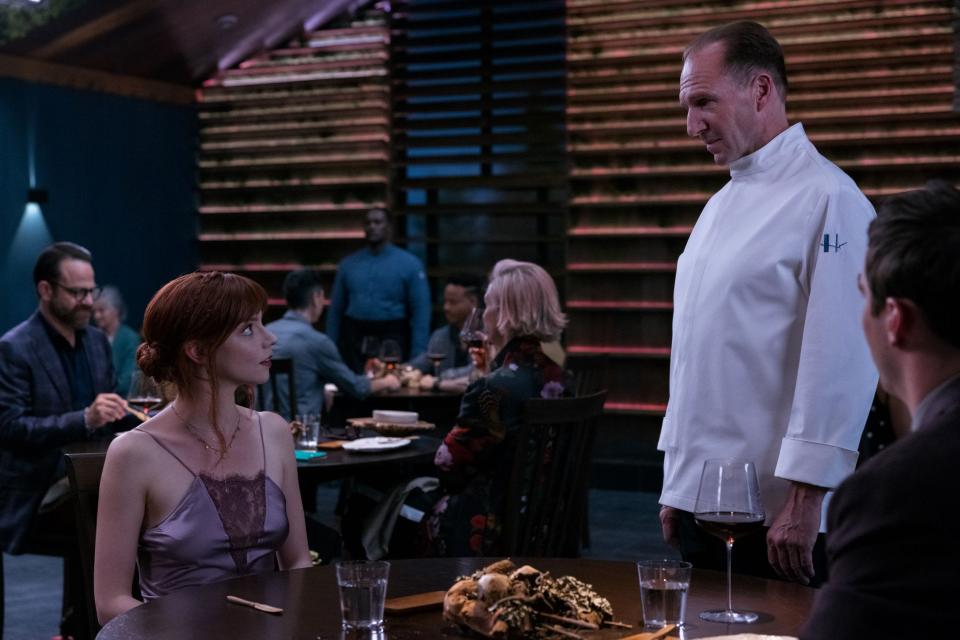 Still from "The Menu," a Searchlight Pictures film starring Anya Taylor-Joy, left, whose character is from Brockton. Here she's speaking with Ralph Fiennes' character, Chef Julian Slowik.