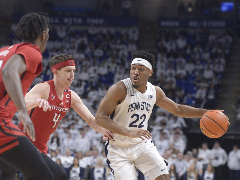 Penn State's Jalen Pickett (22) drives to the basket against Rutgers' Paul Mulcahy (4) during the first half of an NCAA college basketball game, Sunday, Feb. 26, 2023, in State College, Pa. (AP Photo/Gary M. Baranec)