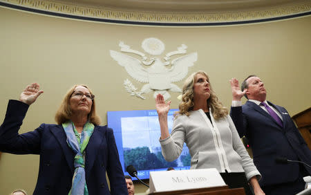 USOC acting chief Susanne Lyons (L), USA Gymnastics CEO Kerry Perry and Tim Hinchey, President and CEO of USA Swimming prepare to testify at a House Energy and Commerce Committee hearing on Olympic athletes and sexual abuse on Capitol Hill in Washington, U.S., May 23, 2018. REUTERS/Jonathan Ernst