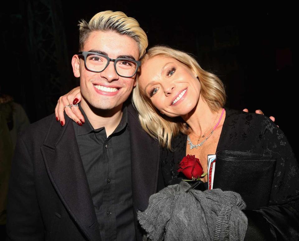 Michael Consuelos and Kelly Ripa pose backstage as Jake Shears of the rock group "The Scissor Sisters" makes his Broadway debut in the hit musical "Kinky Boots" on Broadway at The Al Hirschfeld Theatre on January 8, 2018 in New York City