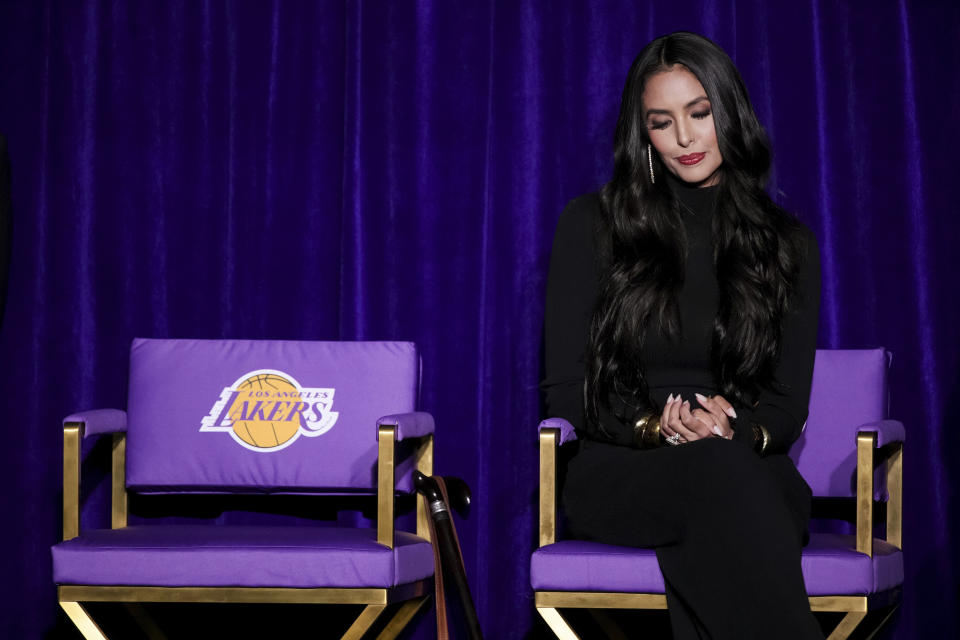 Vanessa Bryant, widow of Kobe Bryant, sits on a chair during the unveiling of a statue of Kobe Bryan outside the NBA basketball team's arena, Thursday, Feb. 8, 2024, in Los Angeles. (AP Photo/Eric Thayer)