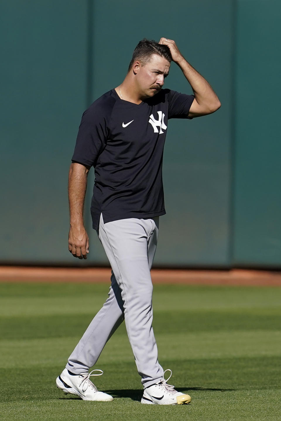 New York Yankees pitcher Greg Weissert warms up before his team's baseball game against the Oakland Athletics in Oakland, Calif., Friday, Aug. 26, 2022. (AP Photo/Jeff Chiu)