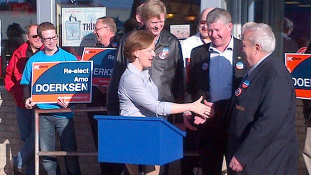 Alberta Progressive Conservative Leader Alison Redford greets colleagues in Strathmore, after promising to establish 140 family-care clinics in the province.