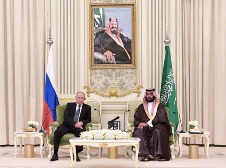 Russian President Vladimir Putin and Saudi Arabia's Crown Prince Mohammed bin Salman attend a meeting in Riyadh