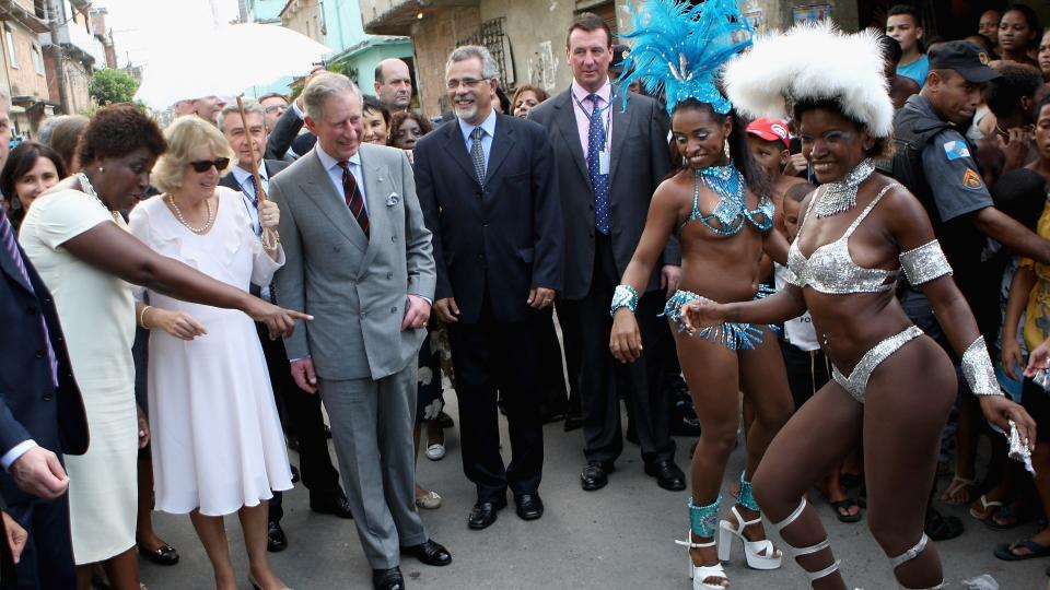 Prince Charles, Prince of Wales and Camilla, Duchess of Cornwall watch traditional Samba dancers perform during a tour of the Marie Complexo Favela on March 12, 2009 in Rio De Janeiro, Brazil. The Prince and the Duchess are in Brazil as part of a ten day tour of South America taking in Chile, Brazil, Ecuador and the Galapagos.