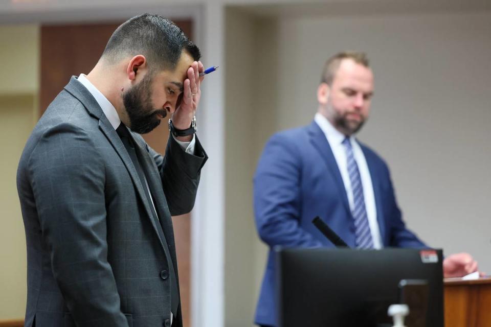 Josh Cuevas, left, public defender, and Joseph Farhoult attend to court cases at the Franklin County District Court in Pasco in February.