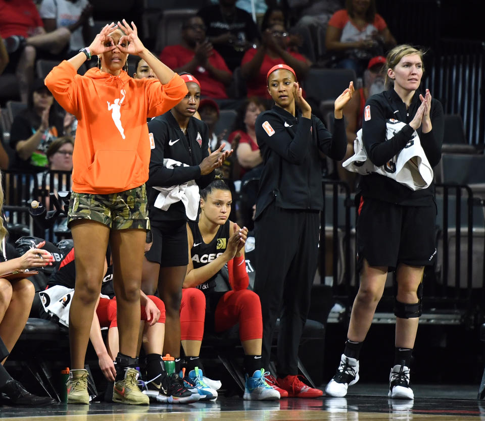 A'ja Wilson, Jackie Young, Kayla McBride, Jaime Nared and Carolyn Swords react on the bench after teammate Sugar Rodgers (not pictured) hit a 3-pointer.