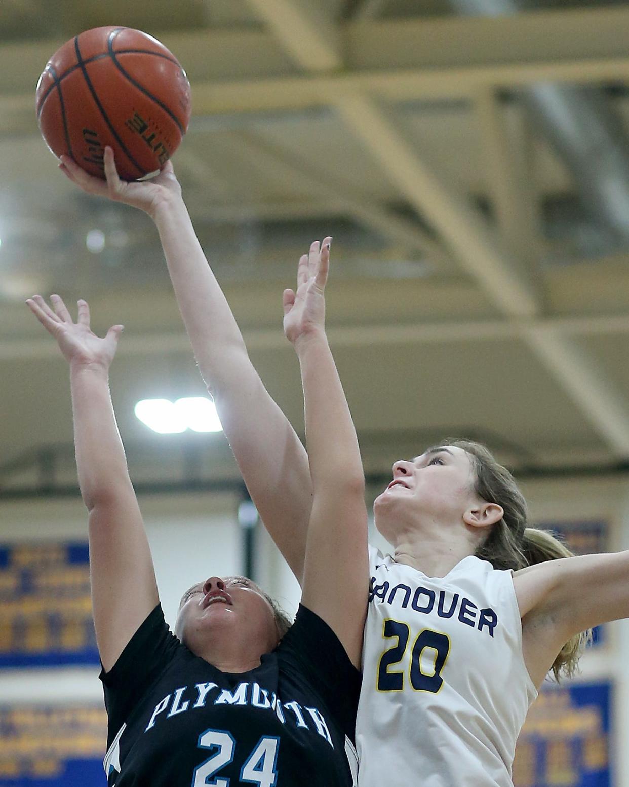 Hanover's Mary Kate Flynn grabs the rebound over Plymouth South's Abby Diamond during second quarter action of their game against Plymouth South at Hanover High on Friday, Feb. 3, 2023. 