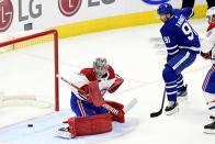 Toronto Maple Leafs' John Tavares (91) scores on Montreal Canadiens goaltender Carey Price (31) during the first period of an NHL hockey game Wednesday, Jan. 13, 2021 in Toronto. (Frank Gunn/The Canadian Press via AP)