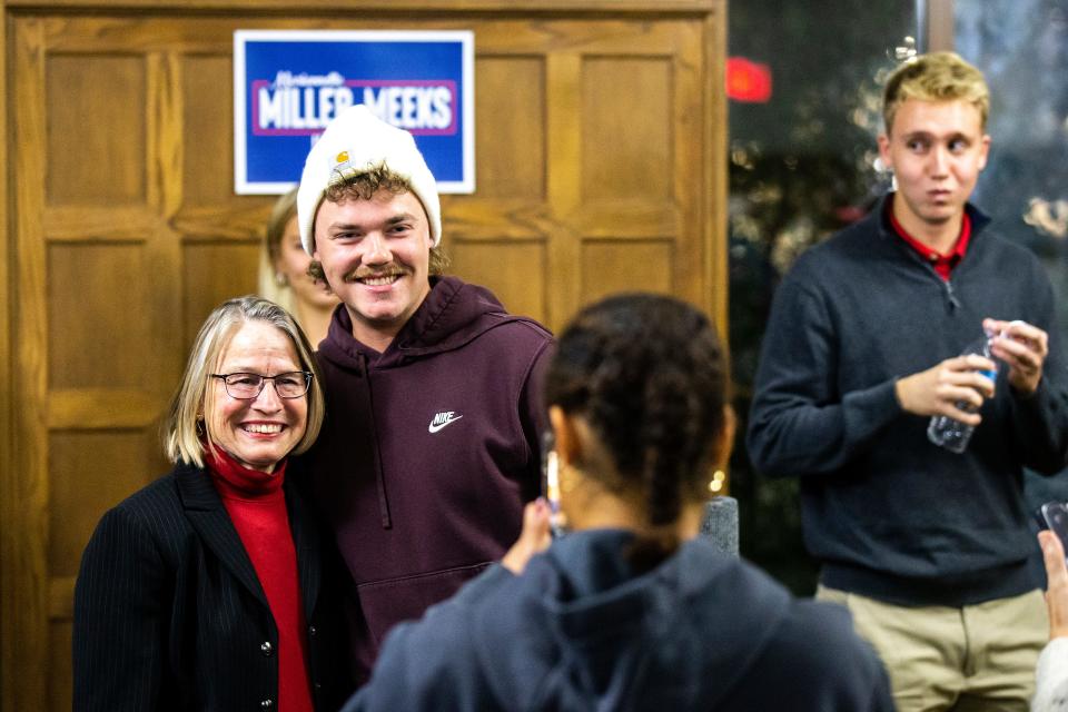 U.S. Rep. Mariannette Miller-Meeks, R-Iowa, left, poses during a University of Iowa College Republicans event Wednesday.