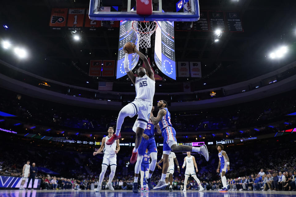 Memphis Grizzlies' GG Jackson (45) goes up for a dunk past Philadelphia 76ers' Cameron Payne (22) during the first half of an NBA basketball game, Wednesday, March 6, 2024, in Philadelphia. (AP Photo/Matt Slocum)