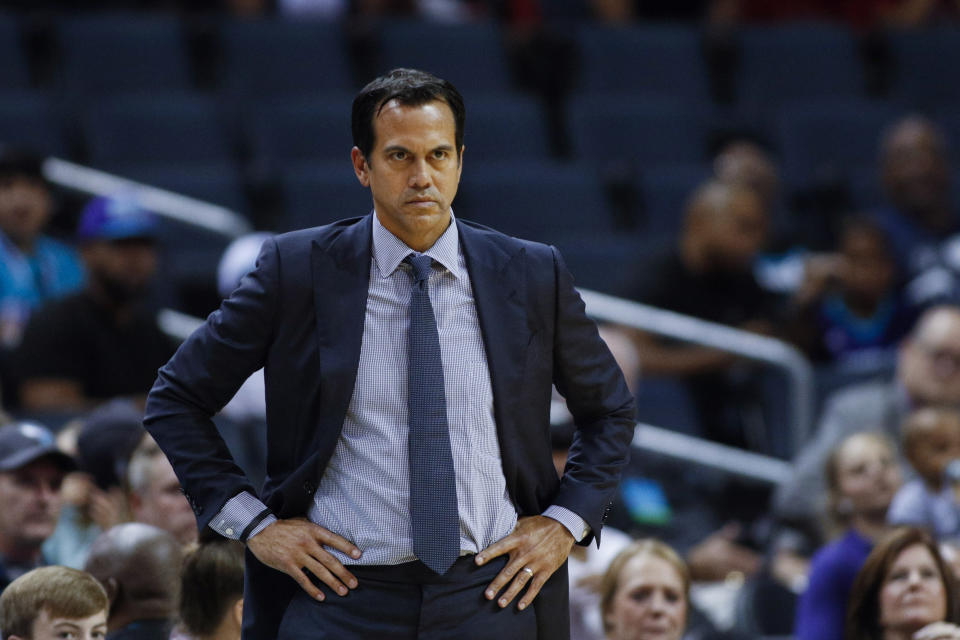 Miami Heat coach Erik Spoelstra watches his team play the Charlotte Hornets during the first half of an NBA preseason basketball game in Charlotte, N.C., Wednesday, Oct. 9, 2019. (AP Photo/Nell Redmond)