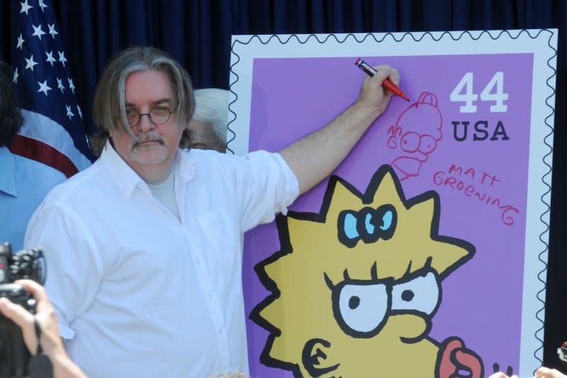 Creator and Executive Producer Matt Groening signs a poster at the unveiling of the new "The Simpsons" U.S. postage stamps in Los Angeles on May 7, 2009. The first U.S. postage stamps were issued on July 1, 1847. File Photo by Jim Ruymen/UPI