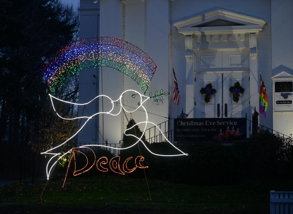 A so-called Sandwich Giant lights up the lawn in front of First Church Sandwich, UCC, last year. Michael Magyar created the giant lighted sculptures which can be seen on display throughout the town during the holiday season.