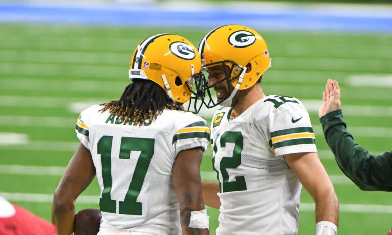 Aaron Rodgers embraces Packers star Davante Adams.