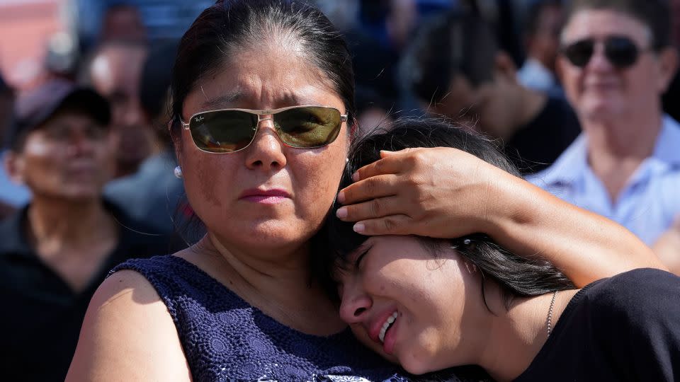 Mourners cry during the funeral Agustin Intriago's funeral in Manta, Ecuador on July 24, 2023.  - Dolores Ochoa/AP