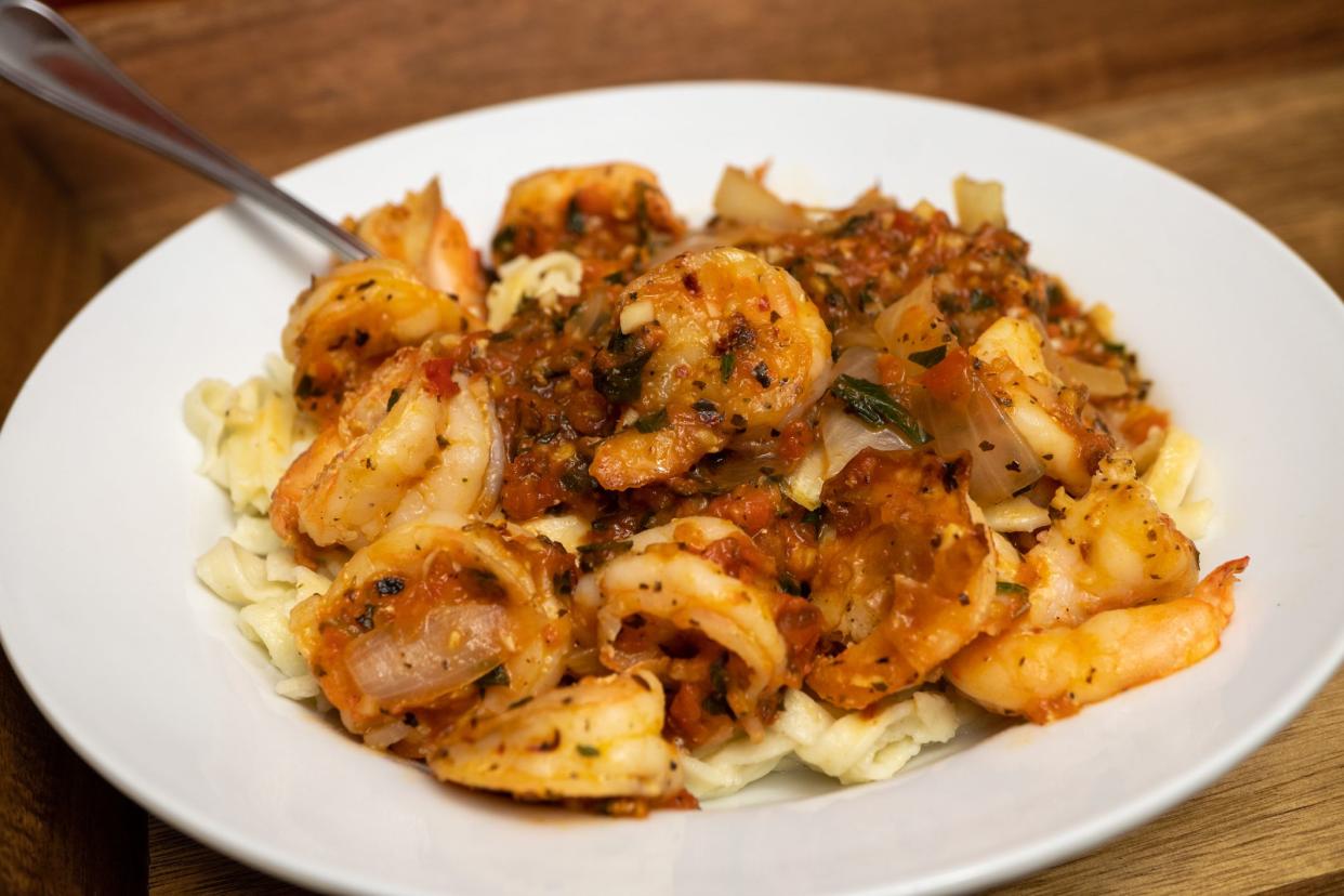 Homemade Shrimp Fra Diavolo - Shrimp in a light and spicy tomato sauce served over fettuccine