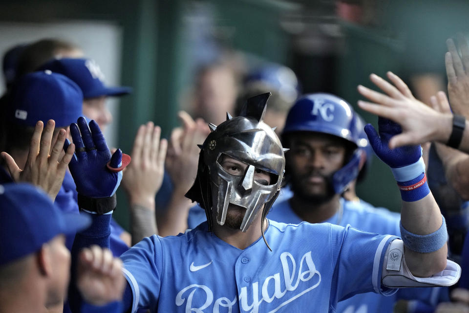 Kansas City Royals shortstop Bobby Witt Jr. celebrates in the dugout after hitting a three-run home run during the second inning of a baseball game against the St. Louis Cardinals Friday, Aug. 11, 2023, in Kansas City, Mo. (AP Photo/Charlie Riedel)