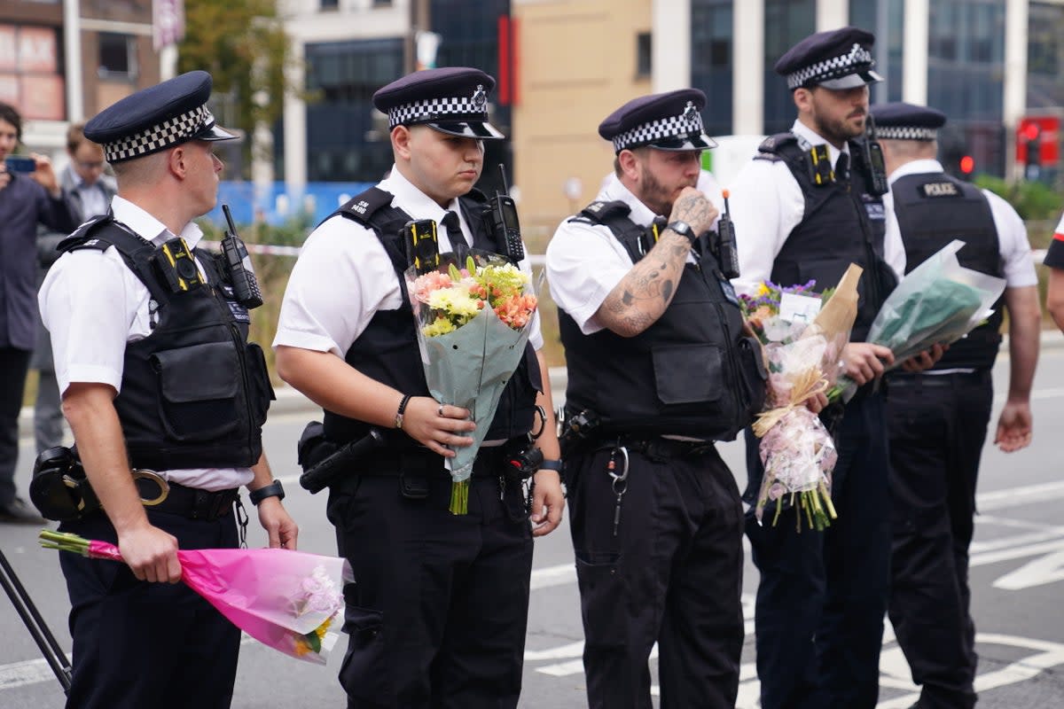 Police officers laid flowers at the scene in Croydon, where Elianne Andem was killed (James Manning/PA Wire)