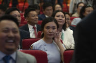 Tsenguun Saruulsaikhan, a young and newly minted member of Mongolia's parliament, waits to receive her Parliament membership card at a ceremony held at the Government Palace in Ulaanbaatar, Mongolia, Monday, July 1, 2024. Tsenguun was one of 42 winning candidates from the Democratic Party, the main opposition group, which made a major comeback after being reduced to a handful of seats in the 2016 and 2020 elections. (AP Photo/Ng Han Guan)