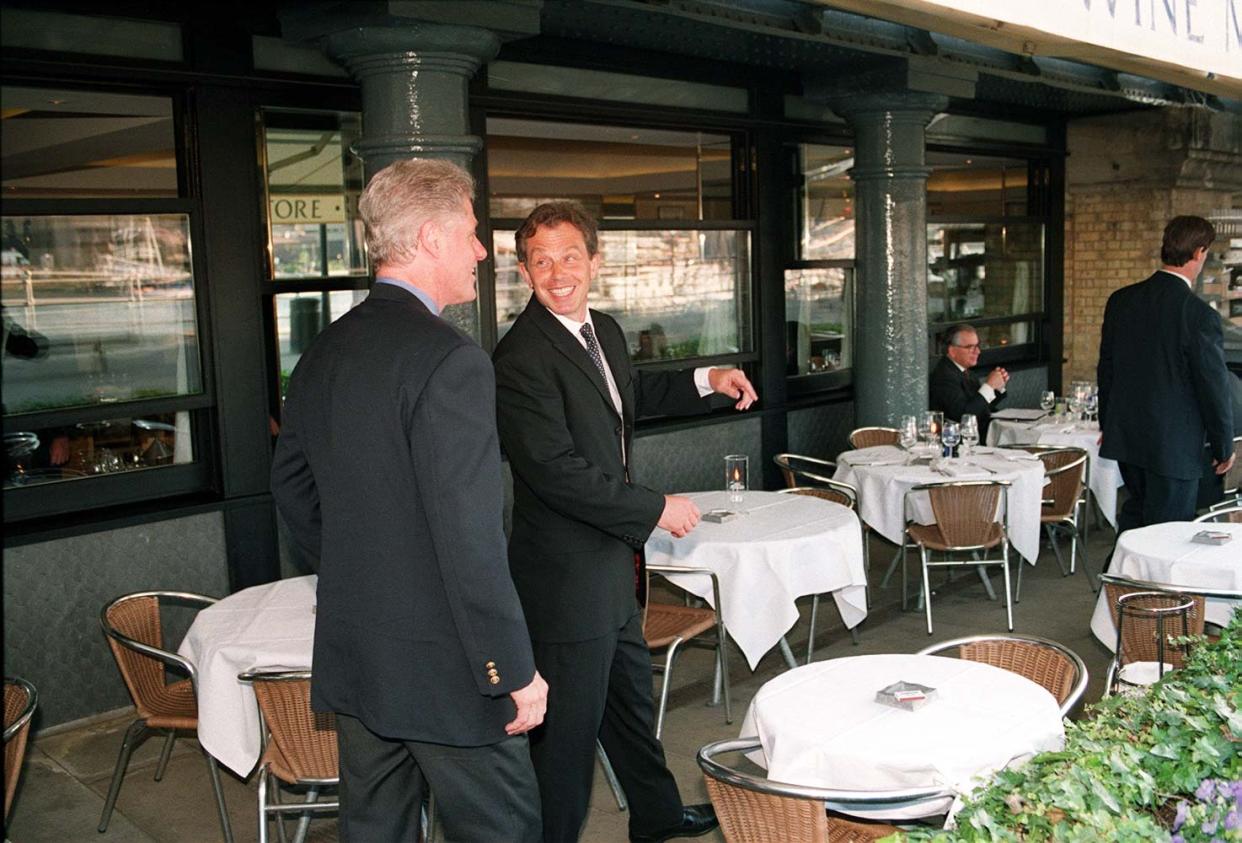 Embargoed to 0001 Tuesday July 20 File photo dated 29/05/1997 of US President Bill Clinton (left) and British Prime Minister Tony Blair at the Le Pont de la Tour restaurant in London. Clinton turned down tea at the Palace with the Queen in 1997 and told aides he wanted 
