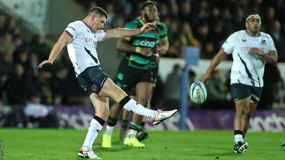 Owen Farrell kicks the ball