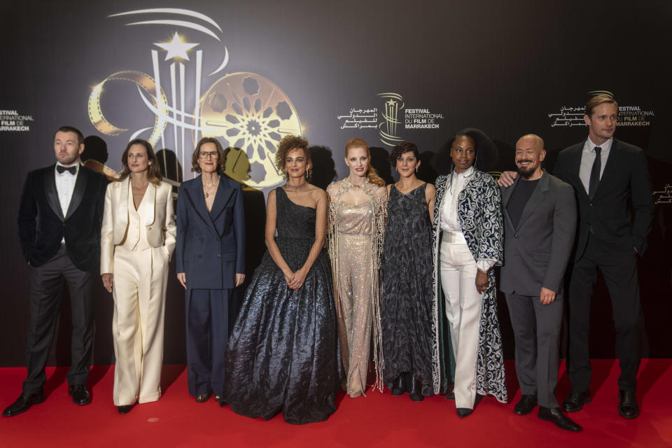 The jury of the Marrakech International Film Festival pose for photos on the red carpet on the opening ceremony, in Morocco, Friday, Nov. 24, 2023. (AP Photo/Mosa'ab Elshamy)