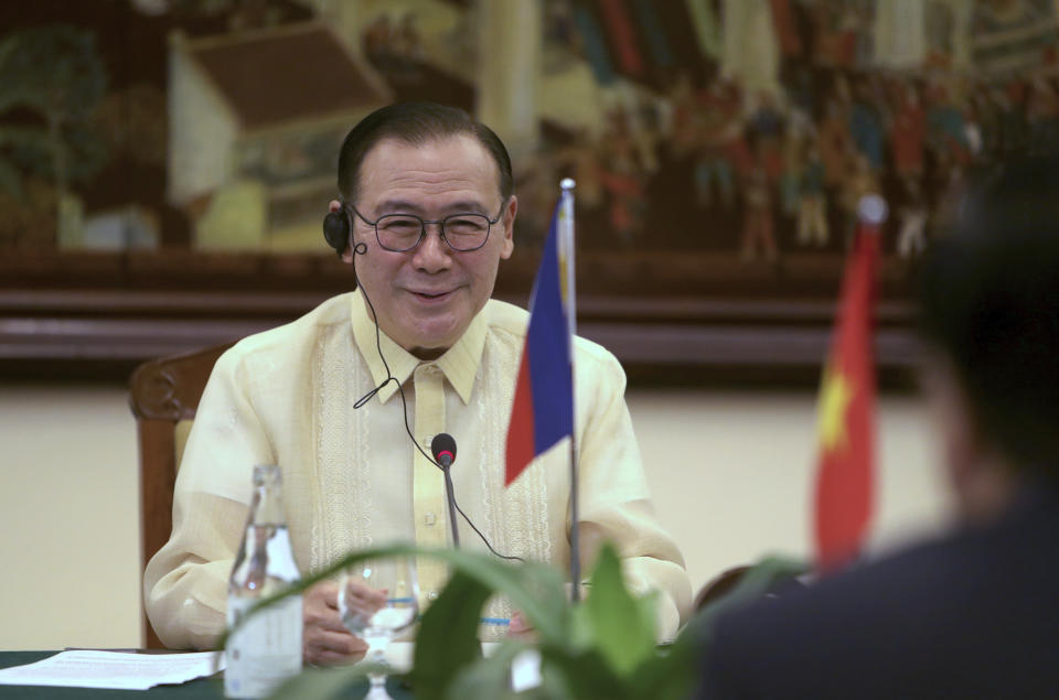 FILE PHOTO: Philippine Foreign Affairs Secretary Teodoro Locsin Jr. speaks to Vietnamese Foreign Minister Pham Binh Minh in Hanoi, Vietnam Monday, July 8, 2019.  (AP Photo/Hau Dinh)