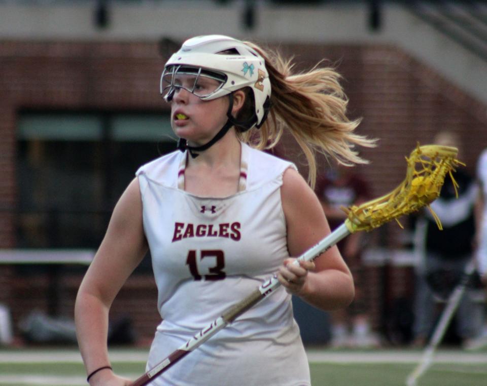 Episcopal attacker Maeve O'Neil (13) advances upfield during an FHSAA Region 1-1A high school girls lacrosse semifinal against St. Augustine.