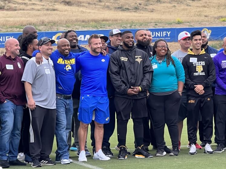 Rams coach Sean McVay poses with more than 60 high school football coaches at Rams training camp