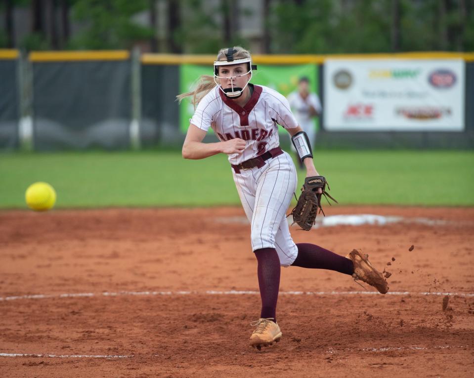 Jessica Farrer (8) pitches during the Gulf Breeze vs Navarre softball game at Navarre High School on Tuesday, April 26, 2022.