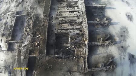 An aerial footage shot by a drone shows the terminal building of the Sergey Prokofiev International Airport damaged by shelling during fighting between pro-Russian separatists and Ukrainian government forces, in Donetsk, eastern Ukraine, seen in this still image taken January 15, 2015 handout video by Army. REUTERS/Army.SOS/Handout via Reuters