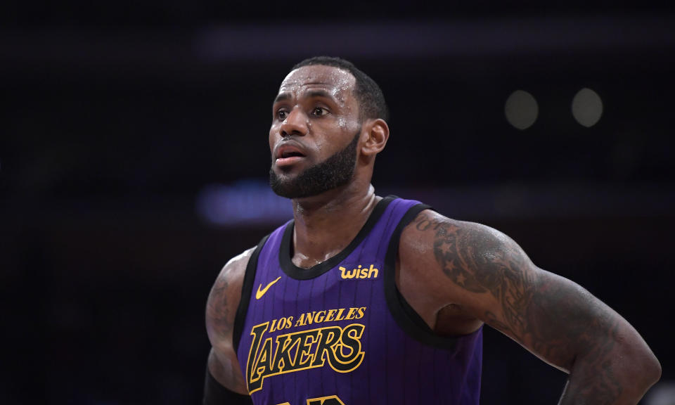 Los Angeles Lakers forward LeBron James stands on the court during the second half of an NBA basketball game against the Brooklyn Nets Friday, March 22, 2019, in Los Angeles. The Nets won 111-106. (AP Photo/Mark J. Terrill)