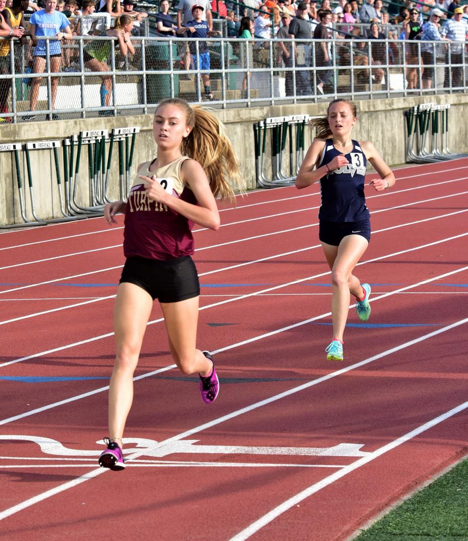 Taken May 17, 2019, Samantha Bush of Turpin and Maddie Walker of West Clermont finished first and second in the 1,600 run at the 2019 OHSAA Division I district track and field meet at Mason's Atrium Stadium.