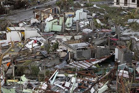 Damaged houses near the airport are seen after super Typhoon Haiyan battered Tacloban city