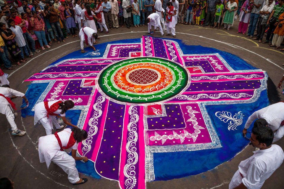 February 22: Rangoli, to welcome well being, Pune, India by <a href="http://www.flickr.com/photos/95012188@N02/12293893044" rel="nofollow noopener" target="_blank" data-ylk="slk:sandeepachetan.com;elm:context_link;itc:0;sec:content-canvas" class="link ">sandeepachetan.com</a>. Huge Rangolis like these, drawn by several artists working in sync adorn the streets of Pune during Ganesh festival. The entire city gets on the streets, dancing, swaying to the beats of the energising musical procession. It is a celebration of their art, history and culture.