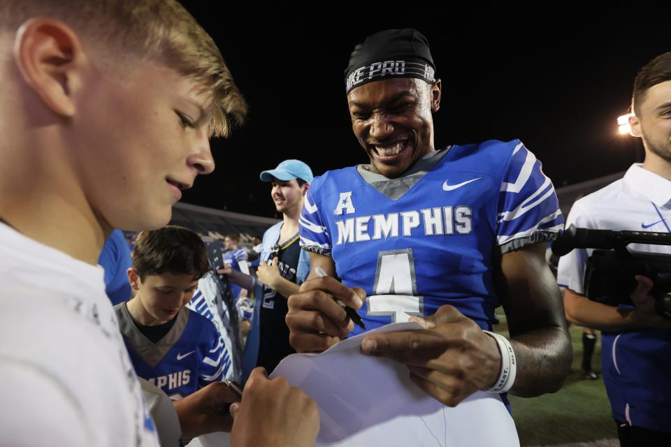 Memphis Tigers receiver Javon Ivory signs autographs after the Friday Night Stripes spring football game at Liberty Bowl Memorial Stadium on Friday, April 22, 2022. 