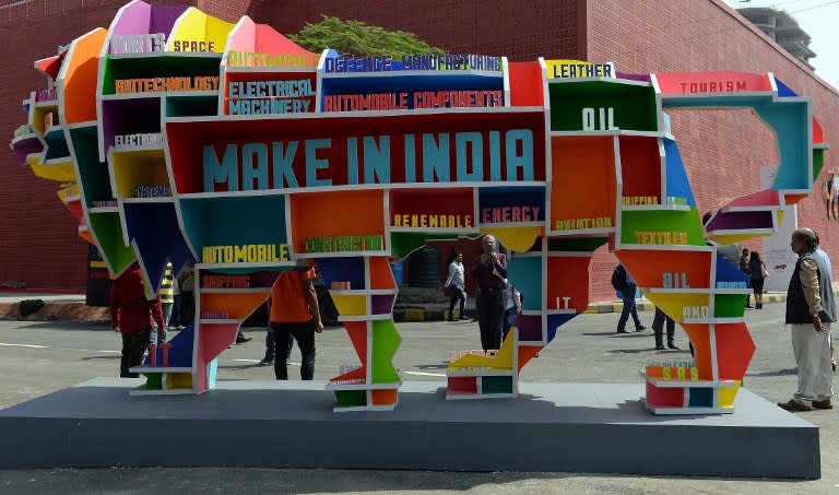 <p>Visitors walk past a sculpture of the mascot of the ‘Make in India Week’ in Mumbai on February 14, 2016. Over 190 companies, and 5,000 delegates from 60 countries, are taking part in the first ‘Make in India Week’ to be held in Mumbai from February 13-18. AFP PHOTO / INDRANIL MUKHERJEE / AFP PHOTO / INDRANIL MUKHERJEE </p>