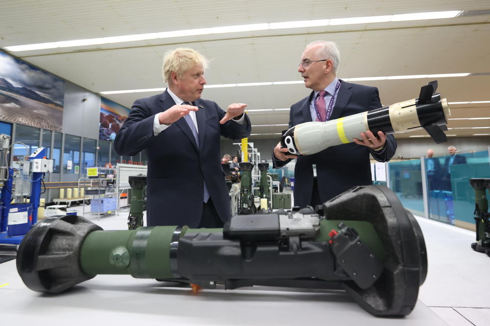 Britain's Prime Minister Boris Johnson is shown the missile from the inside of an NLAW (Next Generation Light Anti-Tank Weapon) by the Managing Director of Thales Belfast, Philip McBride, at Thales weapons manufacturer in Belfast, Monday May 16, 2022, during a visit to Northern Ireland. Johnson said there would be “a necessity to act” if the EU doesn't agree to overhaul post-Brexit trade rules that he says are destabilizing Northern Ireland's delicate political balance. Johnson held private talks with the leaders of Northern Ireland's main political parties, urging them to get back to work. (Liam McBurney/Pool via AP)