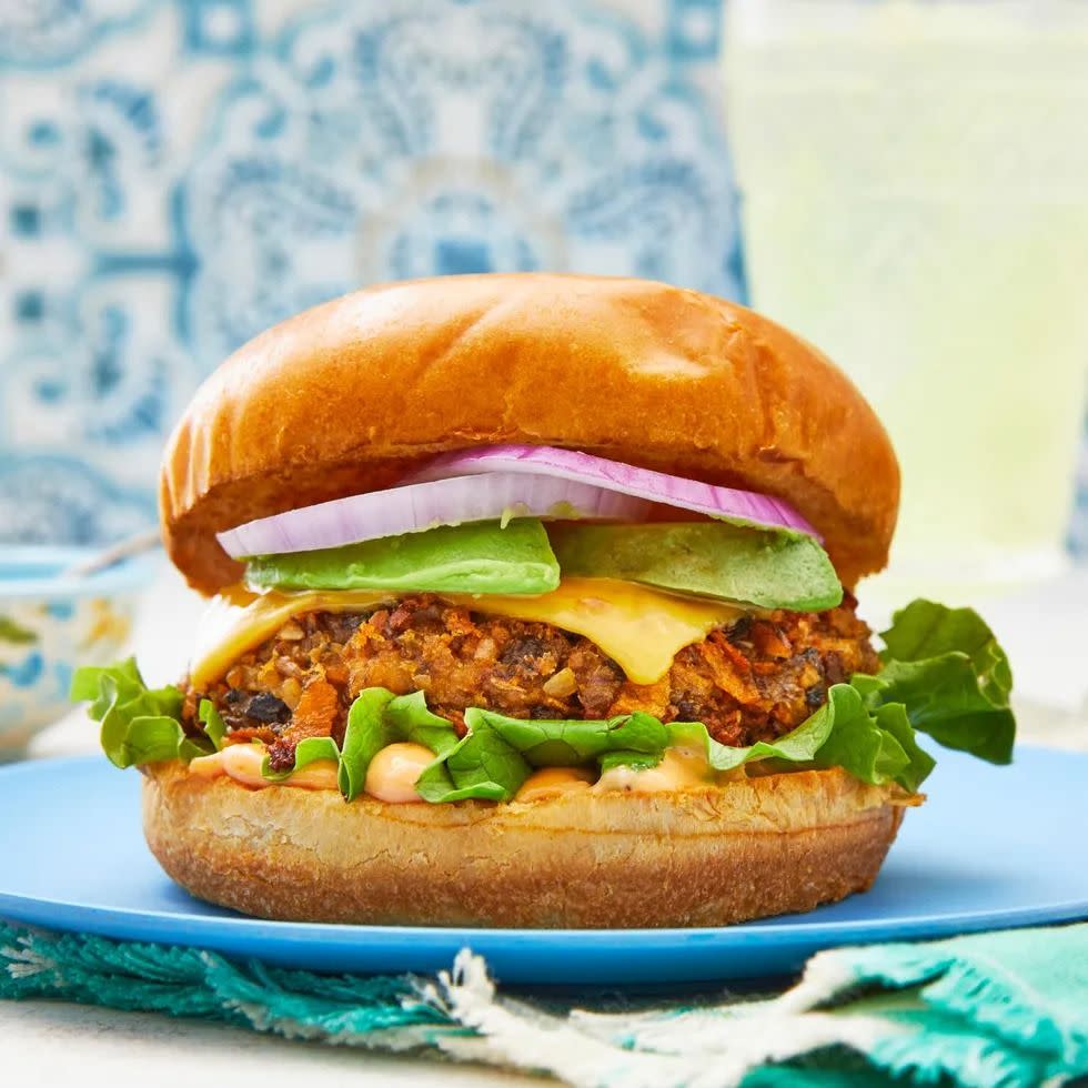 veggie burger with lettuce and onion on bun closeup