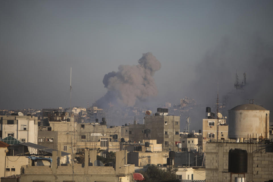 Smoke rises from town of Khan Younis after Israeli strikes on Friday, Dec. 15, 2023. (AP Photo/Mohammed Dahman)