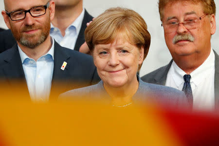 Christian Democratic Union CDU party leader and German Chancellor Angela Merkel reacts after winning the German general election (Bundestagswahl) in Berlin, Germany, September 24, 2017. REUTERS/Fabrizio Bensch